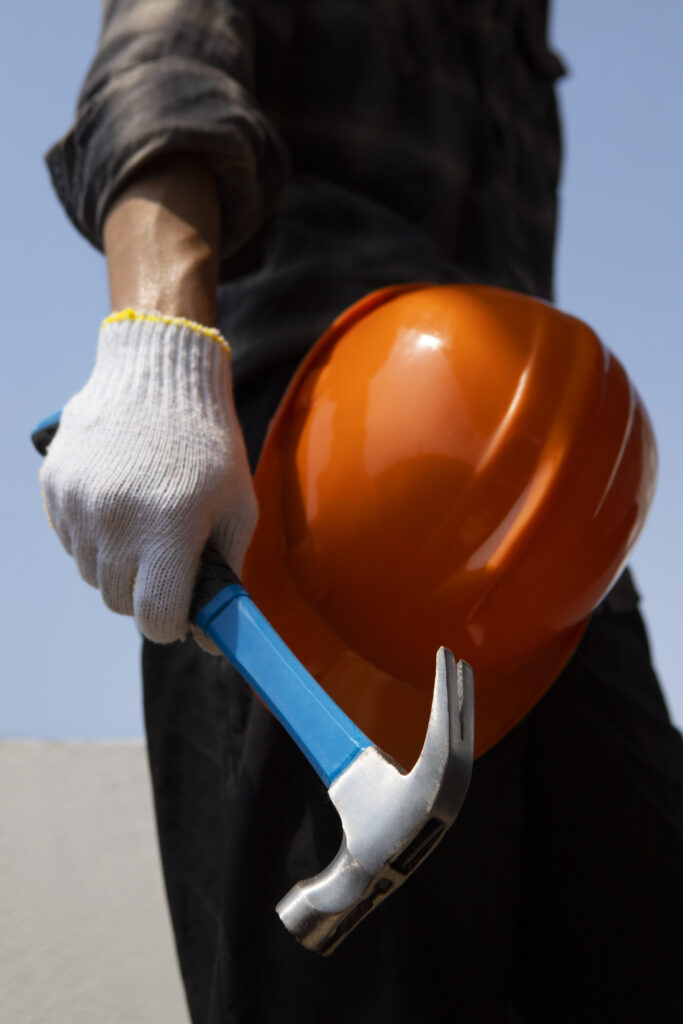 construction worker using hammer job site